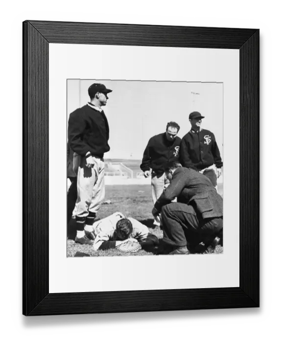 Framed Print : Joe Sprinz Lays On The Ground After Being Struck By Ball Dropped From Blimp Framed Print : Joe Sprinz Lays On The Ground After Being Struck By Ball Dropped From Blimp
