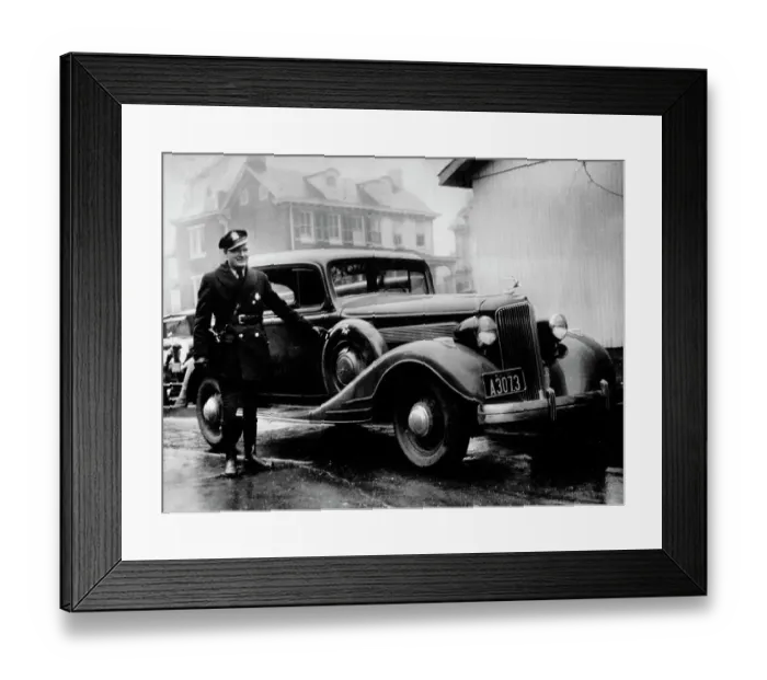 Framed Print : Police Officer With Bullet-Riddled Car Framed Print : Police Officer With Bullet-Riddled Car