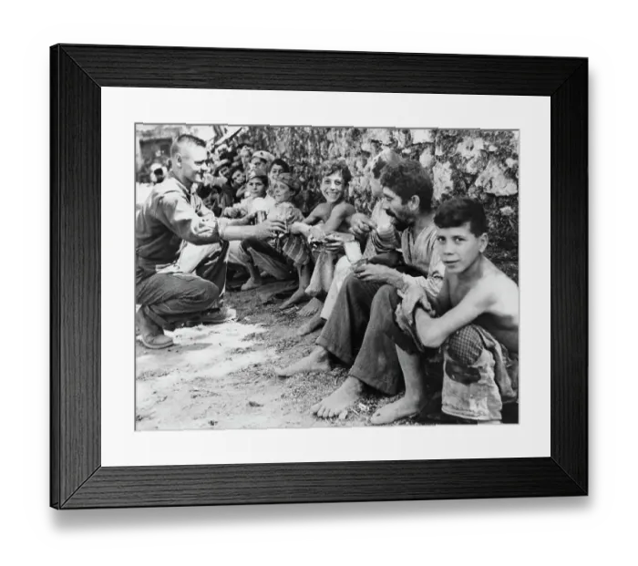 Framed Print : US Soldier Distributing Rations Framed Print : US Soldier Distributing Rations