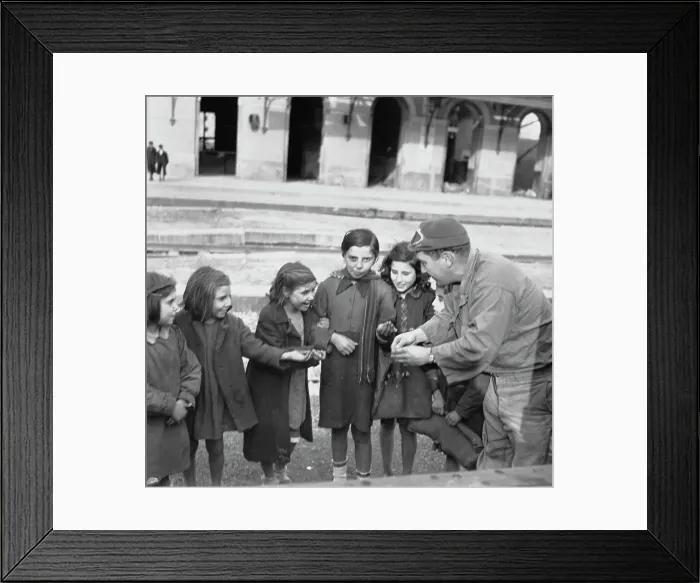 Framed Print : A Soldier Handing Out Sweets