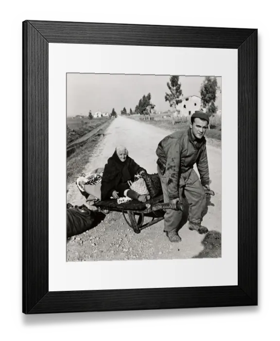 Framed Print : Soldier Pulling Woman On Stretcher Framed Print : Soldier Pulling Woman On Stretcher
