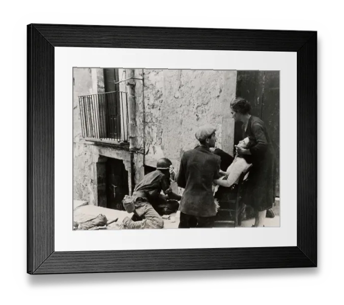 Framed Print : US Medic Treating Italian Woman Framed Print : US Medic Treating Italian Woman