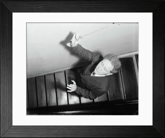 Framed Print : Hans Kindler Posing on Stairs with Baton