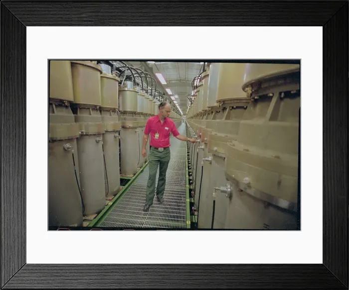 Framed Print : Federal Employee in Warehouse with Electron Guns Framed Print : Federal Employee in Warehouse with Electron Guns