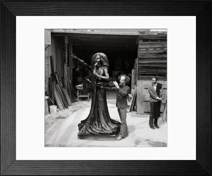 Framed Print : Christopher Gonzalez Examines Bob Marley Monument Which He Created