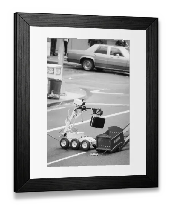 Framed Print : Police Robot Disposing of Suspicious Briefcase