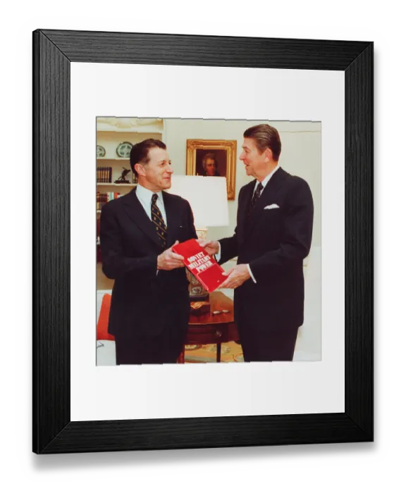 Framed Print : Caspar Weinberger Handing Ronald Reagan a Book Framed Print : Caspar Weinberger Handing Ronald Reagan a Book
