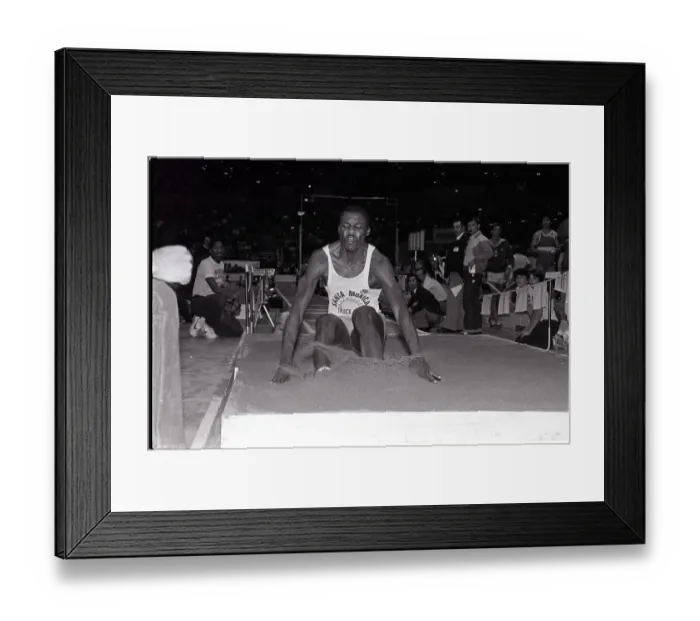 Framed Print : Front View Of Carl Lewis Landing In Sand Framed Print : Front View Of Carl Lewis Landing In Sand
