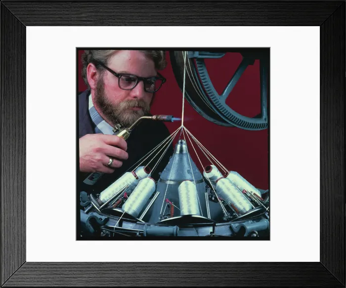 Framed Print : Technologist Applying Flame to Fibers Framed Print : Technologist Applying Flame to Fibers