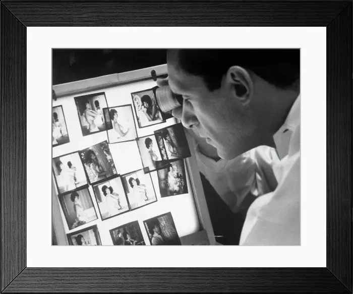 Framed Print : Playboy Publisher Hugh Hefner Observing Photographs Framed Print : Playboy Publisher Hugh Hefner Observing Photographs