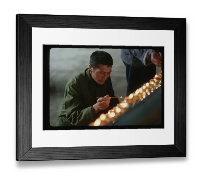 Framed Print : Pilgrim Lights Candles at Temple Framed Print : Pilgrim Lights Candles at Temple