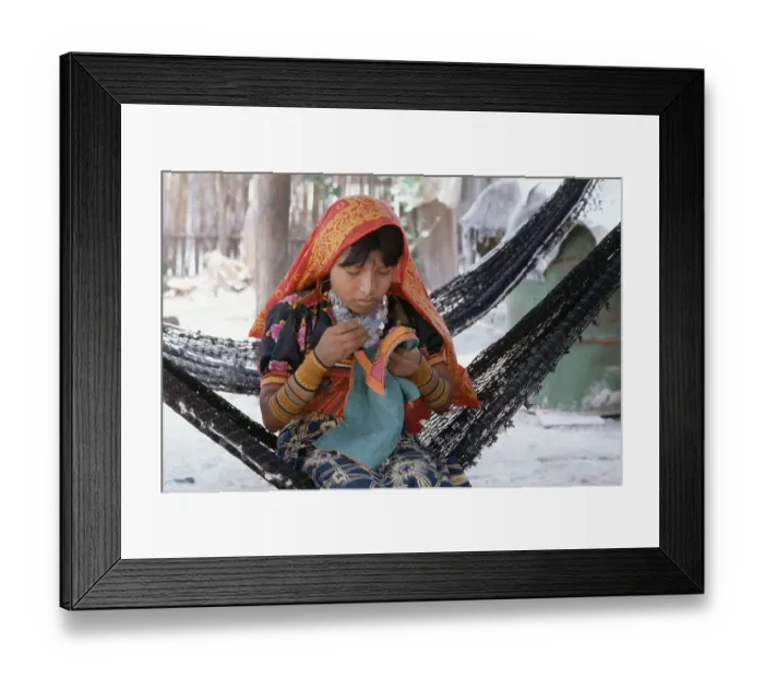Framed Print : Girl Working on Embroidery in Hammock Framed Print : Girl Working on Embroidery in Hammock