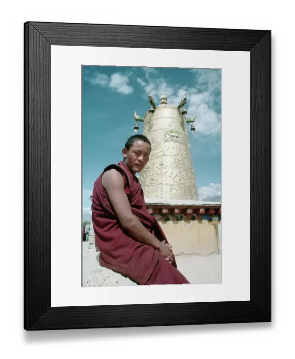 Framed Print : Monk Sits Before Brass Bell Tower Framed Print : Monk Sits Before Brass Bell Tower