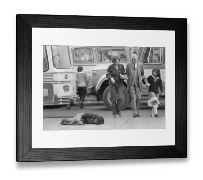 Framed Print : People Passing by Sleeping Child on the Street Framed Print : People Passing by Sleeping Child on the Street
