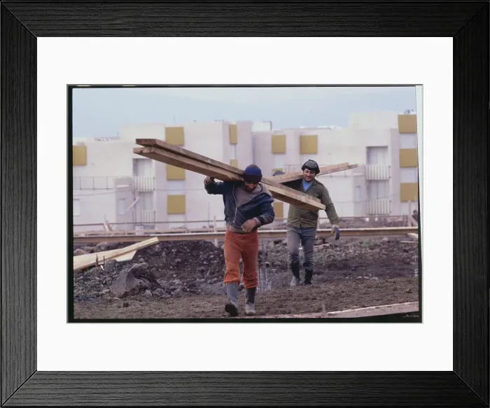 Framed Print : Construction Workers Carrying Railing near Complexes