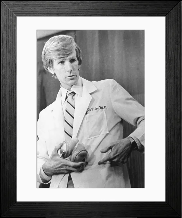 Framed Print : Dr. William DeVries Holding a Jarvik-7 Artificial Heart Framed Print : Dr. William DeVries Holding a Jarvik-7 Artificial Heart