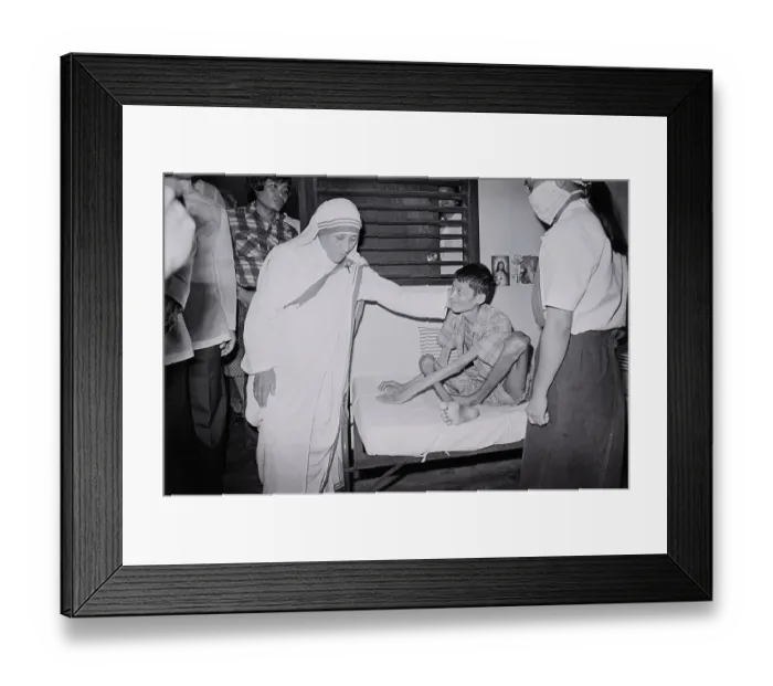 Framed Print : Mother Teresa Comforts Polio Victim Framed Print : Mother Teresa Comforts Polio Victim