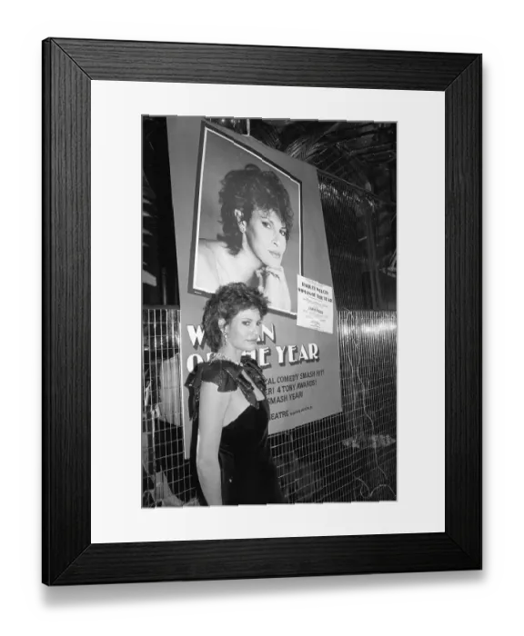 Framed Print : Raquel Welch Stands in Front of Poster Framed Print : Raquel Welch Stands in Front of Poster