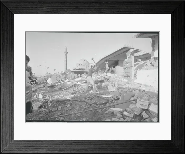 Framed Print : Man Using Sledge to Remove War Torn Debris Framed Print : Man Using Sledge to Remove War Torn Debris