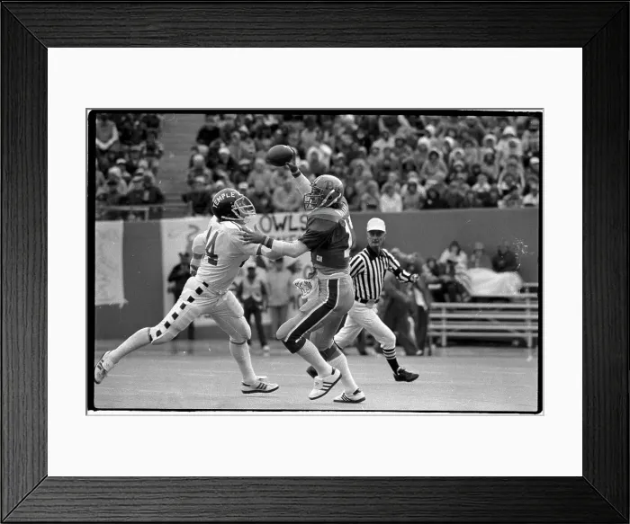 Framed Print : Dan Marino has Football, Gets Rushed by Temple Player Framed Print : Dan Marino has Football, Gets Rushed by Temple Player