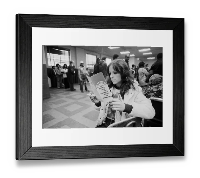 Framed Print : Unemployed Woman Reads A Brochure Framed Print : Unemployed Woman Reads A Brochure