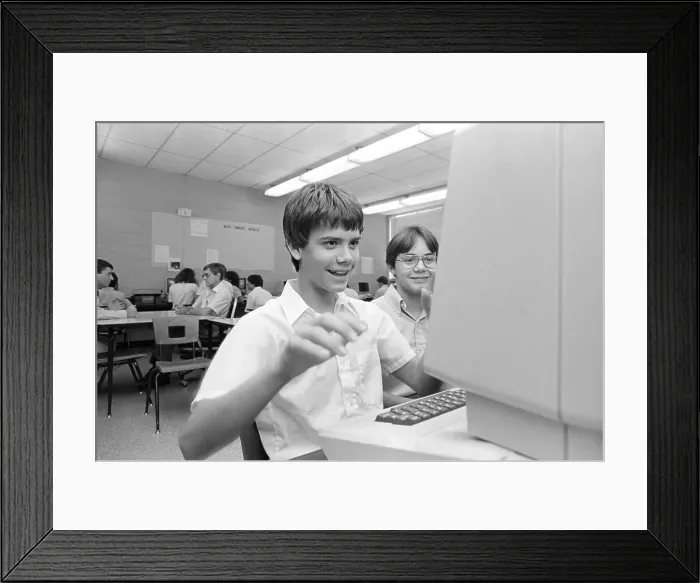Framed Print : Teen Playing German Language Game on School Computer Framed Print : Teen Playing German Language Game on School Computer