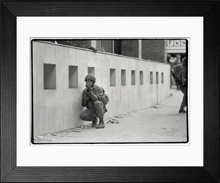 Framed Print : Israeli Soldier Crouches While On Patrol in Beirut Framed Print : Israeli Soldier Crouches While On Patrol in Beirut