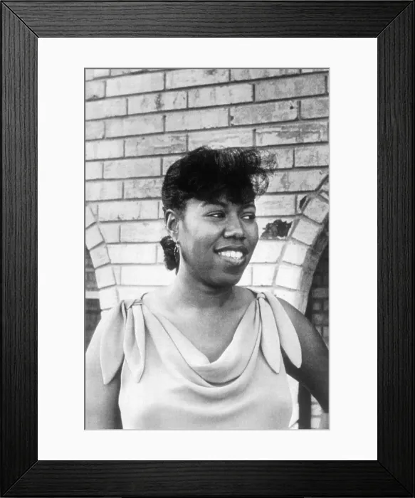 Framed Print : Ruby Bridges Smiling Outside Arched Building Framed Print : Ruby Bridges Smiling Outside Arched Building