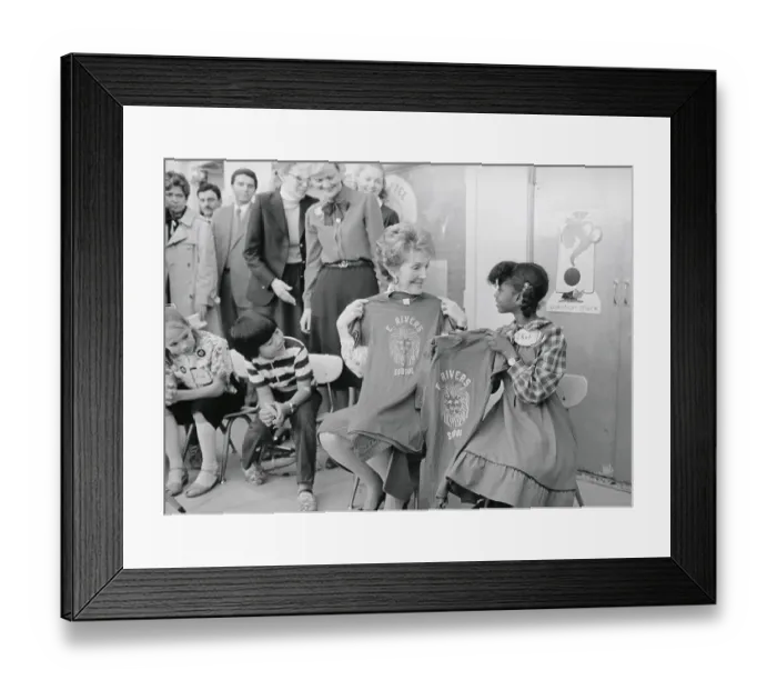 Framed Print : Nancy Reagan Holding Shirt with Student Framed Print : Nancy Reagan Holding Shirt with Student