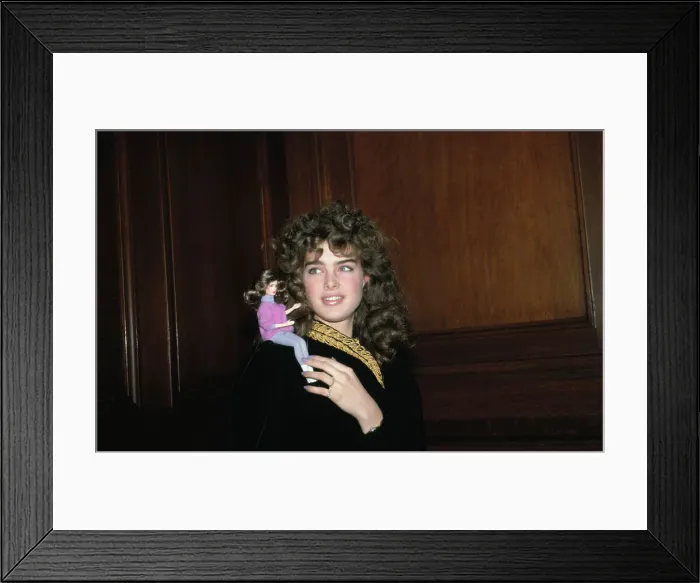 Framed Print : Brooke Shields with Tiny Doll Framed Print : Brooke Shields with Tiny Doll
