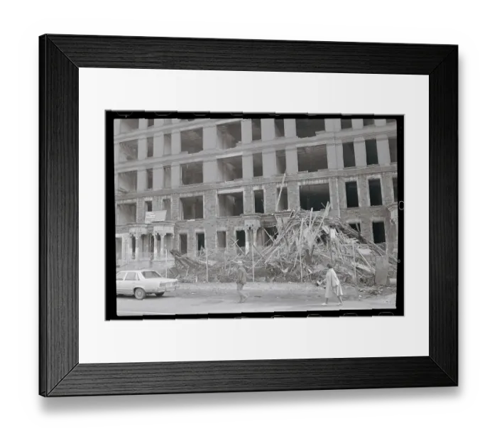 Framed Print : People Passing by a Vacant Building Framed Print : People Passing by a Vacant Building