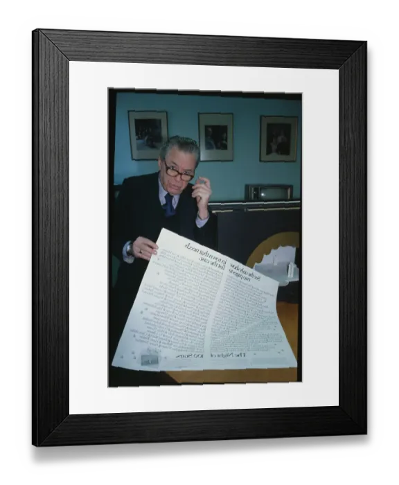 Framed Print : Alexander Cohen Holding Poster Framed Print : Alexander Cohen Holding Poster