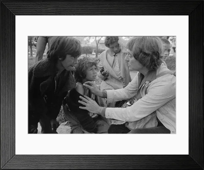 Framed Print : Man Treating a Street Boy's Ailment Framed Print : Man Treating a Street Boy's Ailment