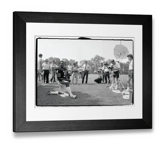 Framed Print : Walter Payton Poses on One Knee for Photographers