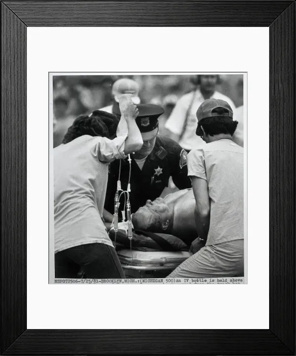 Framed Print : A.J. Foyt Being Moved on Gurney at Track Framed Print : A.J. Foyt Being Moved on Gurney at Track