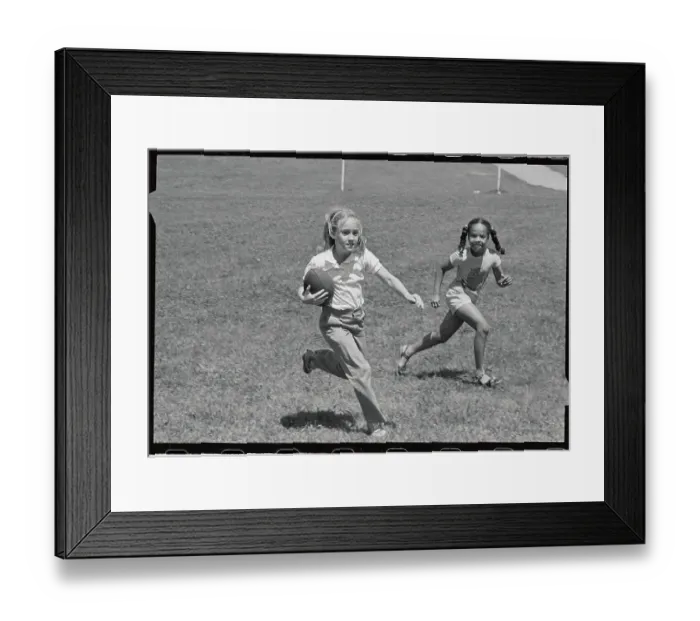 Framed Print : Two Girls Playing Touch Football Framed Print : Two Girls Playing Touch Football