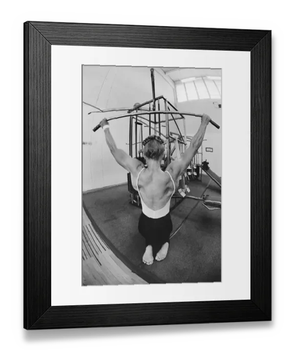 Framed Print : Female Bodybuilder Working out on Weights Framed Print : Female Bodybuilder Working out on Weights