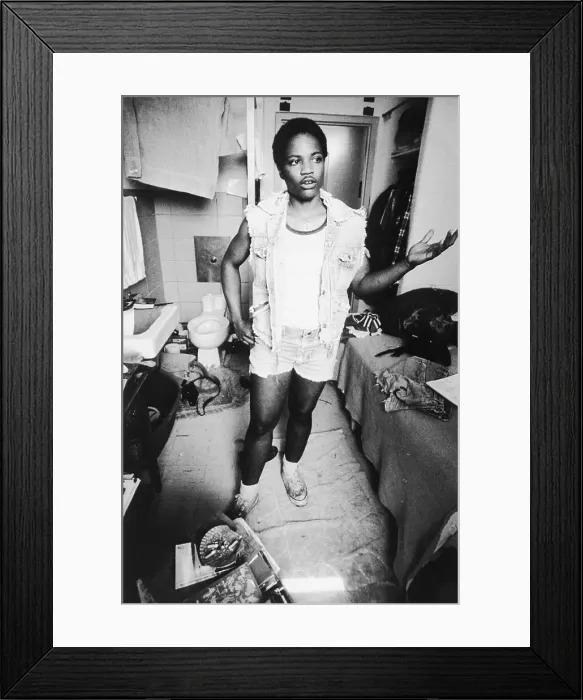 Framed Print : Woman Inmate Standing In Prison Cell Framed Print : Woman Inmate Standing In Prison Cell