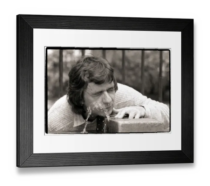 Framed Print : Dudley Moore Tries to Drink Water from Fountain Framed Print : Dudley Moore Tries to Drink Water from Fountain