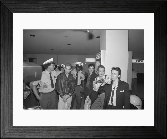 Framed Print : The Clash Standing With Airport Personnel Framed Print : The Clash Standing With Airport Personnel