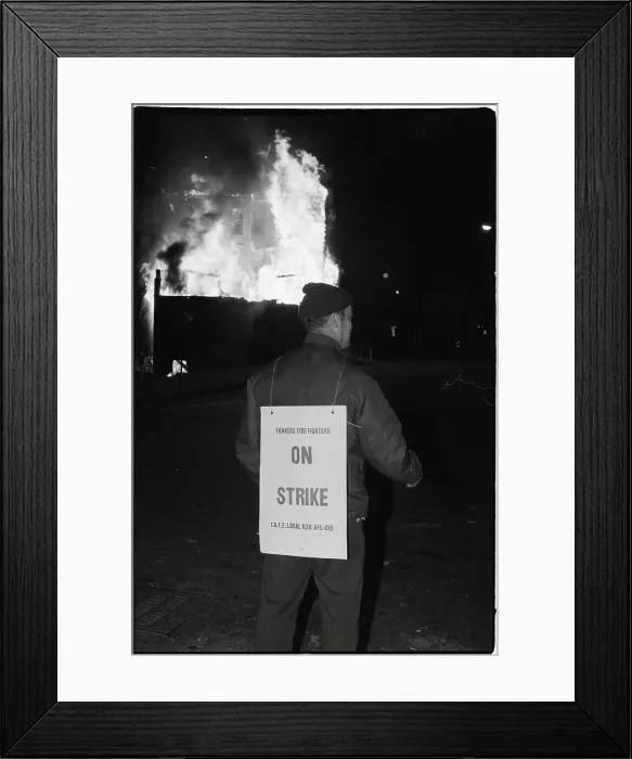 Framed Print : Firefighter on Strike in Front of Burning Building