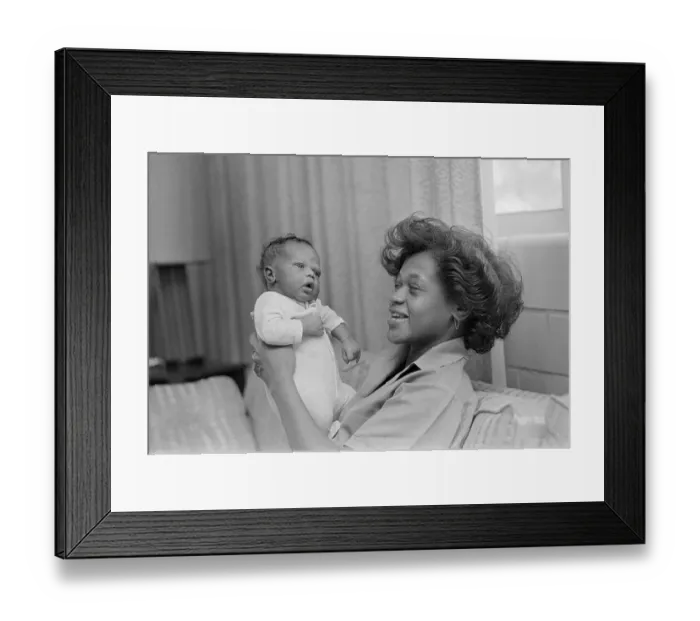 Framed Print : Inmate Holding Small Baby Framed Print : Inmate Holding Small Baby