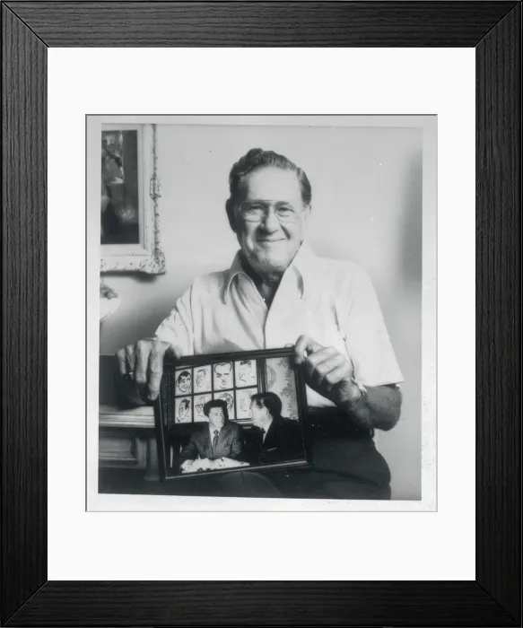 Framed Print : Neil Reagan Holding a Photograph Framed Print : Neil Reagan Holding a Photograph