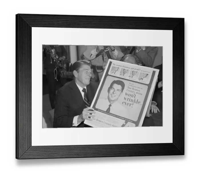 Framed Print : Ronald Reagan Holding an Advertisement Framed Print : Ronald Reagan Holding an Advertisement