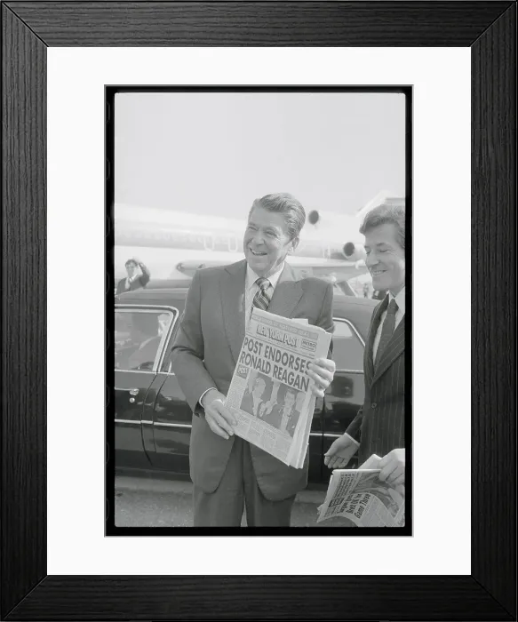Framed Print : Ronald Reagan Holding Newspaper Framed Print : Ronald Reagan Holding Newspaper
