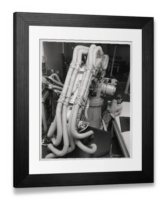 Framed Print : Robot Suction Hoses And Operator Framed Print : Robot Suction Hoses And Operator