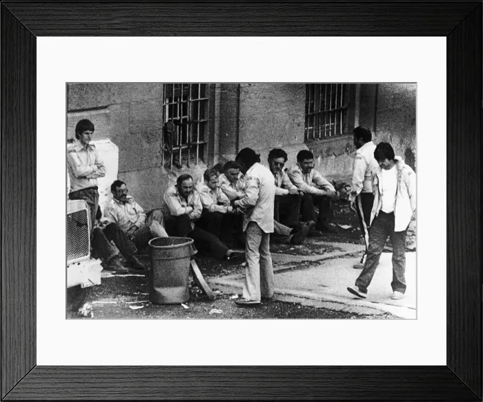 Framed Print : Prisoners Sitting Against Prison Wall Framed Print : Prisoners Sitting Against Prison Wall