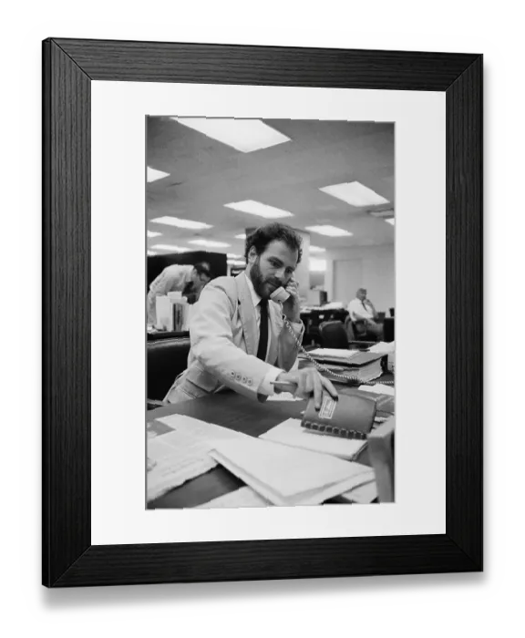 Framed Print : Jerry Rubin on Phone in Wall St. Office