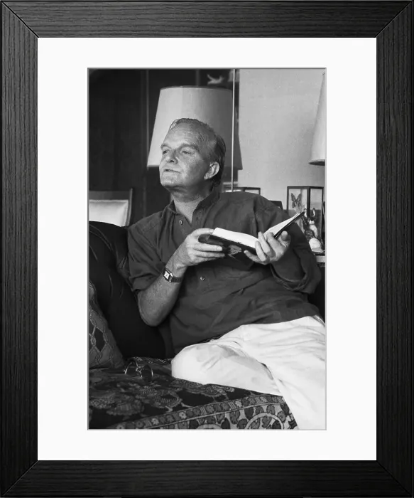 Framed Print : Truman Capote 3 / 4 Length On Sofa Talking