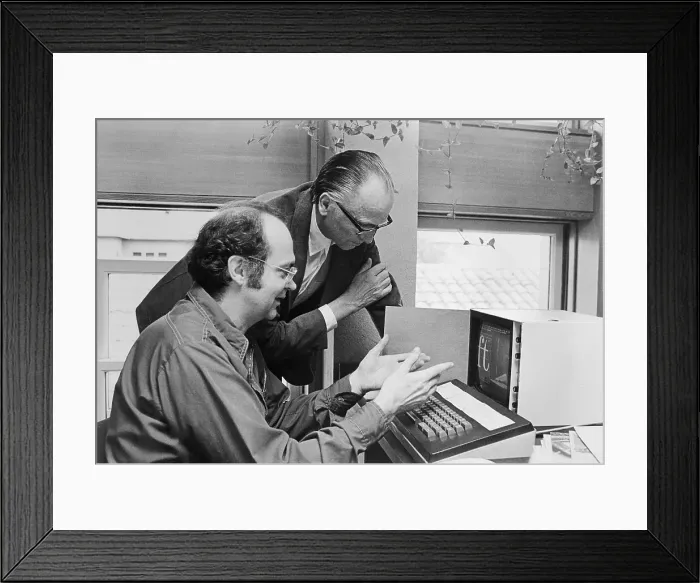 Framed Print : Typewriting Engineers Working on Machine Framed Print : Typewriting Engineers Working on Machine